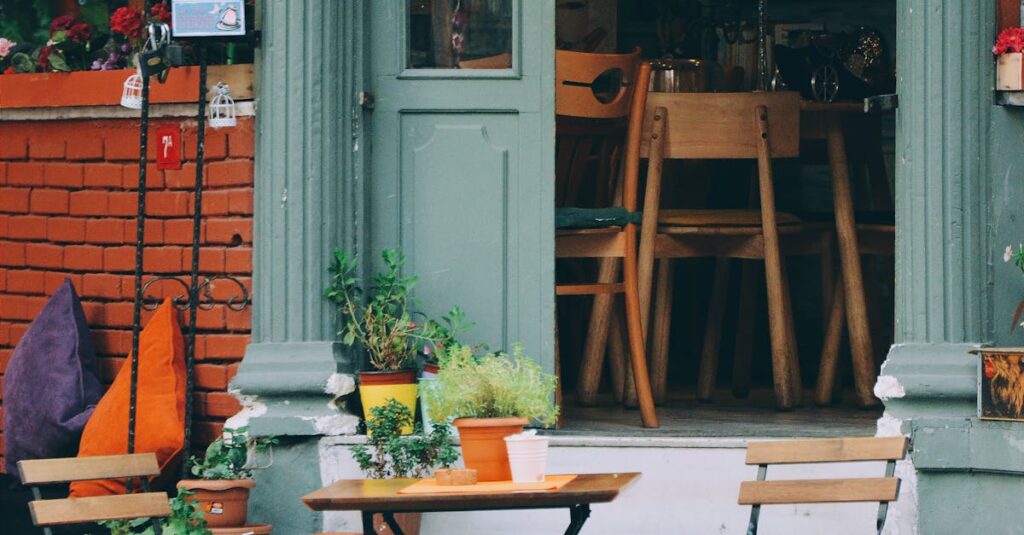 Cozy outdoor café with colorful chairs and rustic design. Ideal for travel and urban lifestyle imagery.
